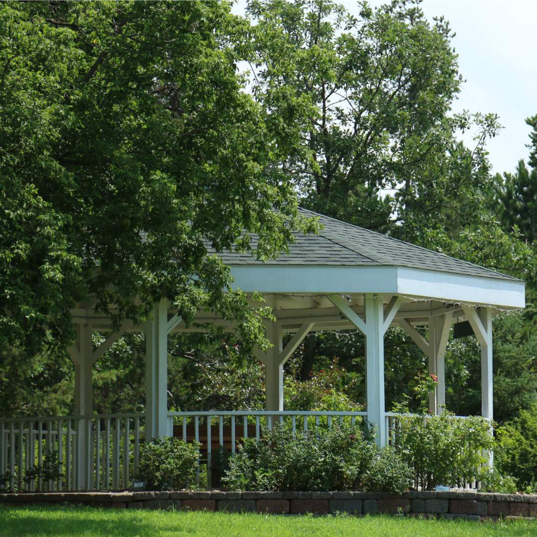 The Holden Gazebo behind some trees.