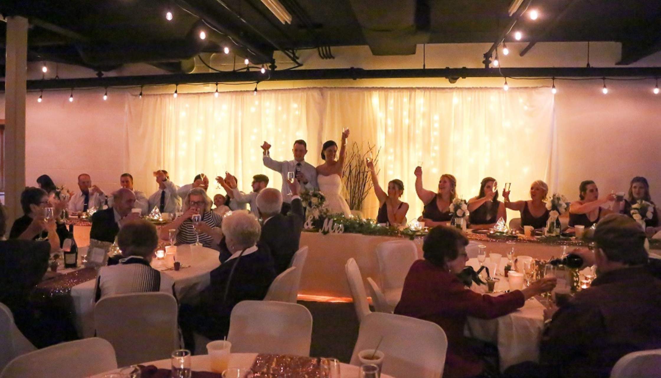 A wedding group in the creekside room.